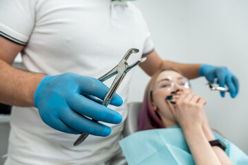 Upset woman with phobia having panic attack in  clinic.