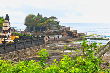 BALI, INDONESIA - CIRCA NOVEMBER 19, 2023 Tanah Lot Temple, an important Hindu temple located on a...