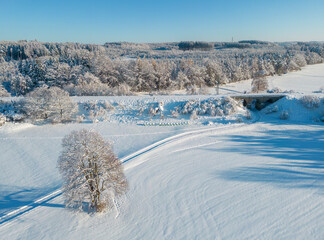 Aerial view of a snow-covered winter wonderland in southern Bavaria, Germany 