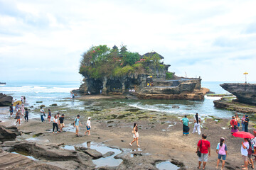 BALI, INDONESIA - CIRCA NOVEMBER 19, 2023 Tanah Lot Temple, an important Hindu temple located on a...