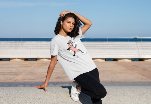 Mockup of woman wearing customizable t-shirt with hand in hair