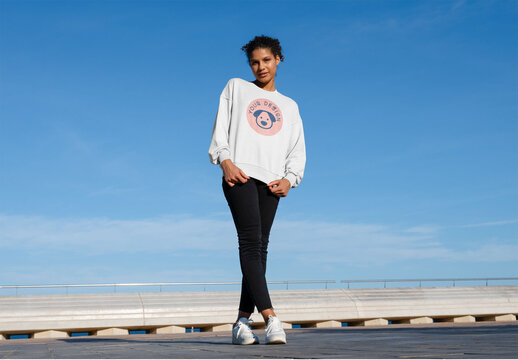 Mockup of woman wearing customizable sweatshirt, standing full length