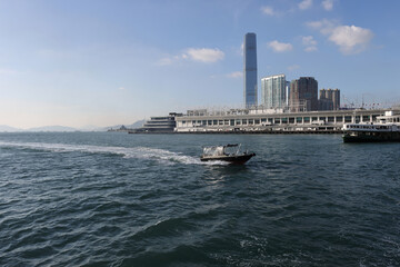 Fototapeta premium Hong Kong-November 16, 2023- The start ferry is Tsim Sha Tsui to Wan Chai Ferry and Central ferry terminal pier is a favourite way to cross from Kowloon side to Hong Kong. Best view of the city. 