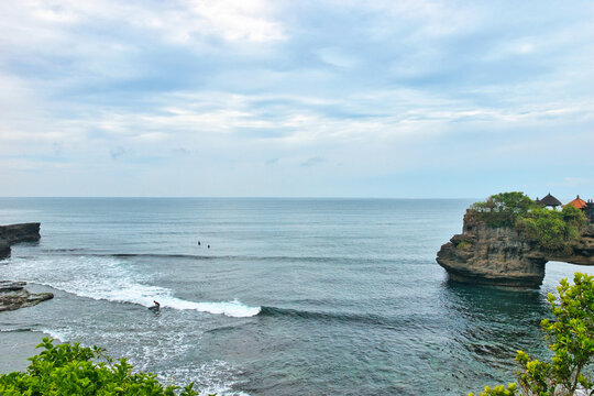 BALI, INDONESIA - CIRCA NOVEMBER 19, 2023 Tanah Lot Temple, an important Hindu temple located on a rock offshore in South Bali, NOVEMBER 19, 2023 Indonesia. This was during the wet season.
