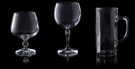 set of empty glasses isolated on black background