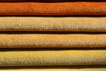 Collection of colorful upholstery fabric samples. Close up. Multicolor fabric texture background.