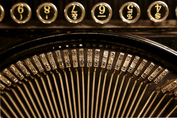 Vintage typewriter focusing on the typebars.