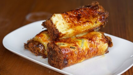 Roti abon gulung (Roll Abon) or meat floss sweet savoury bread roll with shredded meat floss filling topped.