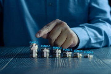 Business planning and strategy concepts Stack of coins with arrow icons and investment funds, stock...