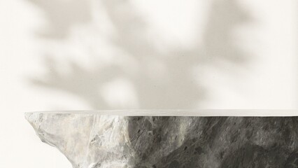 Modern gray rock stone side table podium with texture in sunlight on white room background. Luxury...