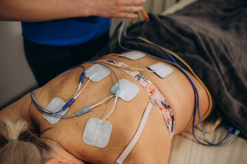 Lower Back Physical Therapy with TENS Electrode Pads, Transcutaneous Electrical Nerve Stimulation....