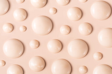 cosmetic smears drops of cream texture on beige background