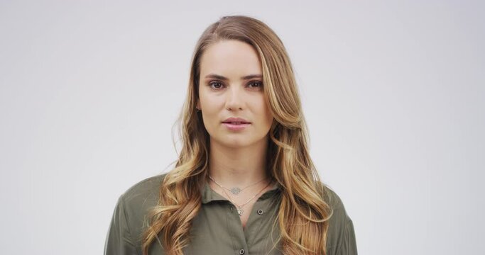 Worker, serious and face of woman proud, professional and confident isolated in a studio white background. Employee, ready and young corporate person or entrepreneur with startup company or business