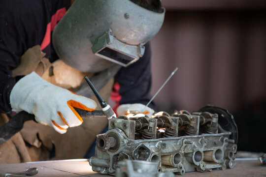 Welder is welding Tungsten Inert Gas welding, Welding aluminum with aluminum argon, TIG welding torch.