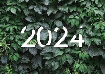 2024 New year white text hidden in natural green leaves wall - Powered by Adobe