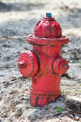 Red hydrant on the beach