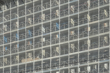 renovation of the external facade of a building, metal scaffolding with protection net