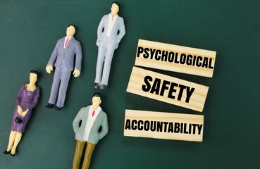 miniature and wooden people with the word psychological safety accountability. Mental health...