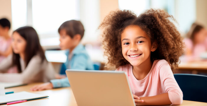 African American girl seated at table, utilizing laptop for online lesson