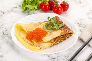 Russian pancake with red caviar