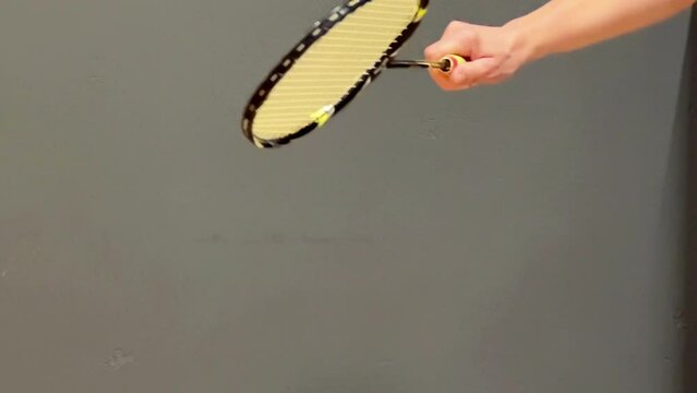 Badminton. Shuttlecock serve. Feather shuttlecock and racket. Sports games.