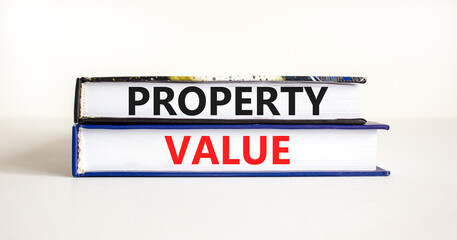 Property value symbol. Concept words Property value on beautiful books. Beautiful white table white background. Business property value concept. Copy space.