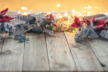 Cozy Christmas background with decorative details on a wooden surface.