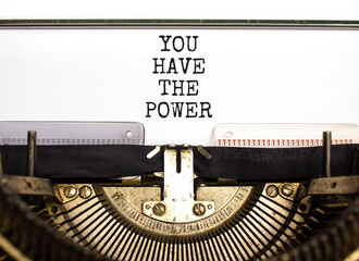 You have the power symbol. Concept word You have the power typed on beautiful old retro typewriter. Beautiful white paper background. Business motivational you have the power concept. Copy space.