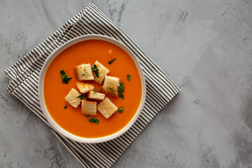 Homemade Butternut Squash Soup in a Bowl, top view. Flat lay, overhead, from above. Copy space.