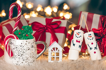 Christmas gift box by the fireplace, copy space.