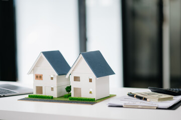 balancing the property sector The real estate agent is explaining the house style to see the house...