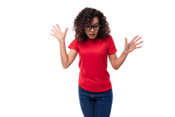 young promoter woman dressed in a red basic t-shirt with printable mockup isolated on white background with copy space