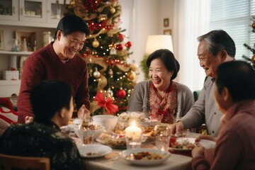 Asian family of 70 year old grand parents, 40 year old parents having a Christmas lunch in daylight, with a beautifully decorated living room with bright soft natural light coming from the windows