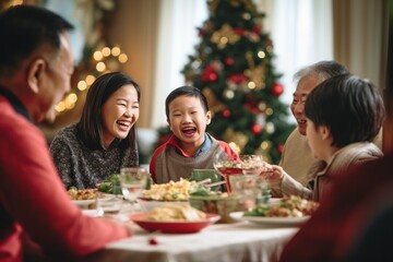 Asian family of 70 year old grand parents, 40 year old parents having a Christmas lunch in daylight - 687915192