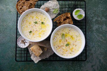 Warming cheesy soup with truffle oil