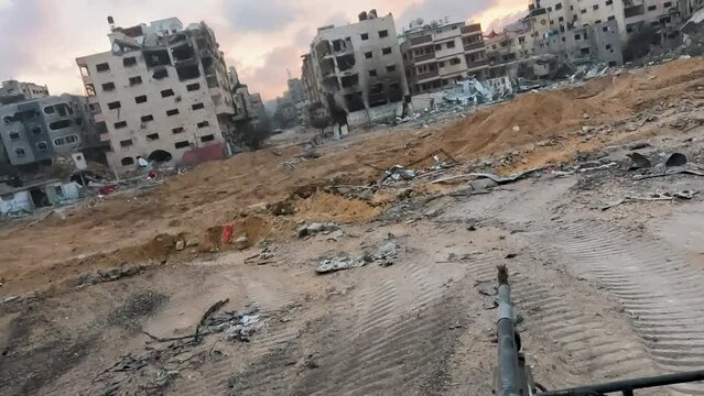 Clips of buildings destroyed by Israeli attacks in a civilian neighborhood in western Gaza.