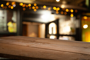 Perspective empty wooden table from above on blurred bokeh background can be used mockup to display installation products or design mockup.