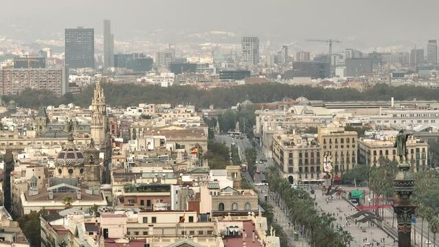 day time flight over barcelona city traffic street famous christopher columbus monument top aerial panorama 4k spain