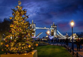 A beautiful Christmas Tree in front of the defocussed Tower Bridge of London, England, during an...