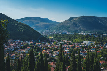 Mostar city in Bosnia and Herzegovina areal view from above, summer cityscape. Travel to the Balkans