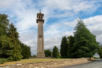 Low angle view of 1846 Somerset Monument, Hawkesbury Upton, UK to commemorate Lord Robert Edward Somerset, a soldier who fought in the Peninsular War and the War of the Seventh Coalition - obrazy, fototapety, plakaty