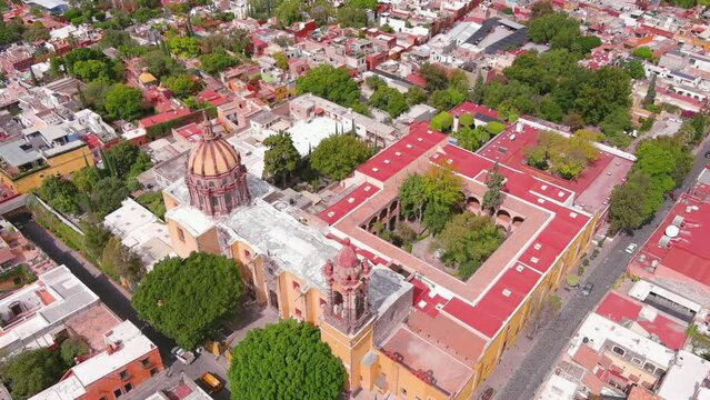 Mexico, San Miguel de Allende: Aerial view of colonial-era city, Centro Cultural Ignacio Ram&iacute;rez El Nigromante and Church of the Immaculate Conception - landscape panorama of Latin America from above
