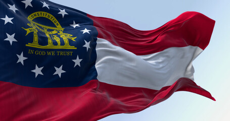Close-up of Georgia state flag waving in the wind on a clear day