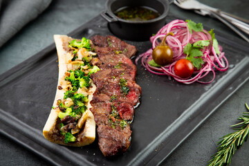 lamb ribs with cauliflower onions, broccoli and soy sauce, side view