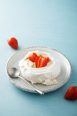 Traditional Pavlova dessert with fresh strawberry