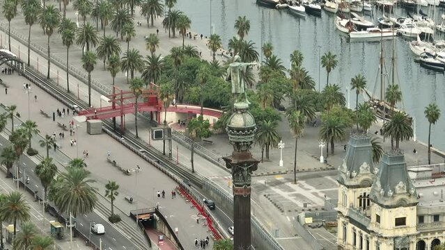 day time flight over barcelona city traffic street famous christopher columbus monument top bay aerial panorama 4k spain