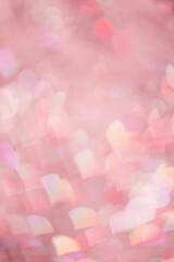 Abstract bokeh background pink color, natural flare from lights as hearts, pink monochrome photo,...