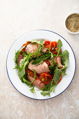 Arugula salad with roast beef and tomatoes