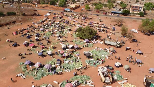 Aerial video of a market area where people shop in Burkina Faso Africa