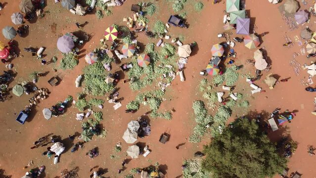 Aerial video of a market area where people shop in Burkina Faso Africa